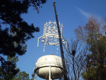 Placing apparatus on water tower
