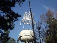 Placing apparatus on water tower